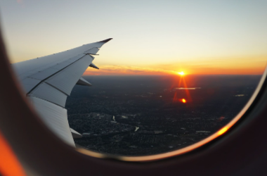 view of a sunset from the window of an airplane