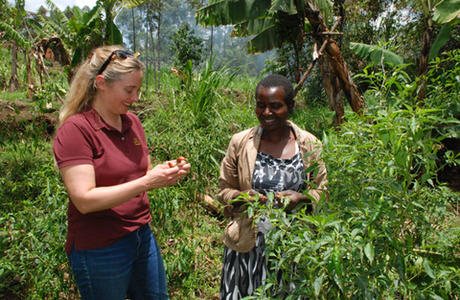 Rose Kerubo, a Kenyan farmer (right), discusses her growing strategies and pest management with Annalisa Hultberg,  Extension food systems educator