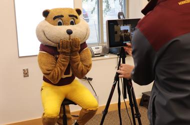 Goldy Gopher poses for a passport photo