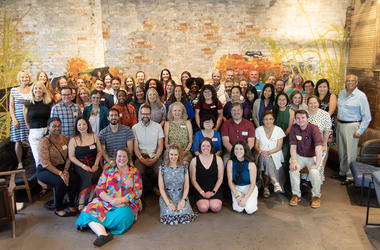 LAC staff and on-site staff pose for a photo