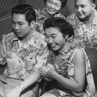 Undated: Students pose in floral attire and leis