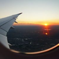 view of a sunset from the window of an airplane