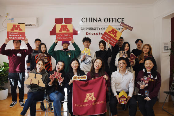 Students pose with UMN themed props