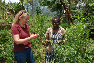 Rose Kerubo, a Kenyan farmer (right), discusses her growing strategies and pest management with Annalisa Hultberg,  Extension food systems educator