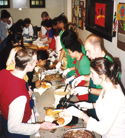 Line of students being served Thanskgiving dinner