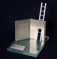 award sculpture with a glass plate and a book and ladder made of aluminum