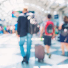 Diffused photo of people walking through an airport