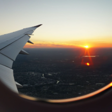 view of a sunset from the window of an airplane